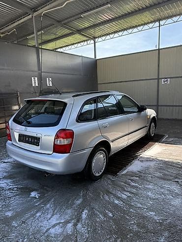 mercedesbenz 211: Mazda 323: 2000 г., Механика, Бензин, Универсал — 4