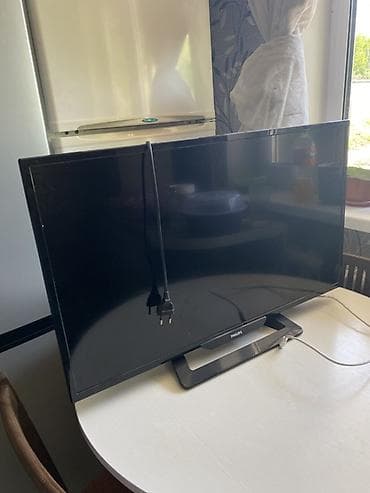 ТВ и видео: Телевизор Philips, диагональ примерно 32–40". Светодиодная (LED) — 1