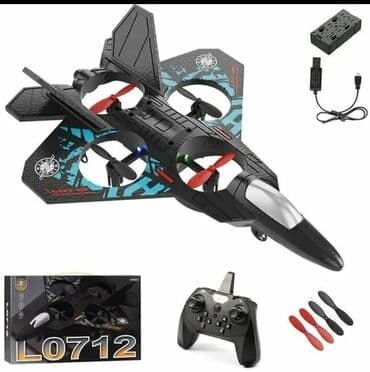 дрон с пультом: ДРОН в форме самолета, выполненный в черном цвете. Оснащен четырьмя — 1