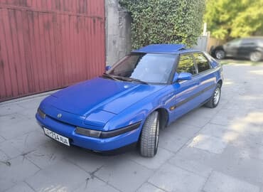 меняю дом на машину: Mazda 323: 1994 г., 1.6 л, Механика, Бензиновая, Хэтчбэк — 1