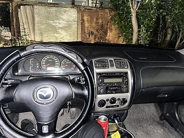 салон жасайбыз: Mazda 323: 2001 г., 1.6 л, Кол менен иштөөчү, Хетчбек — 1