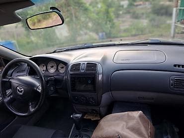 Mazda Familia: 2002 г., 1.6 л, Автомат, Бензин, Седан — 4