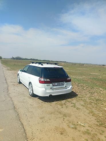 devo lasetti: Белый универсал с рейлингами на крыше. Компактный кузов, пять дверей — 7