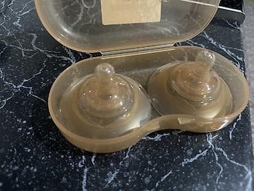 теплая обувь: Накладки на грудь New Line в футляре. - Комплект: 2 силиконовые — 1