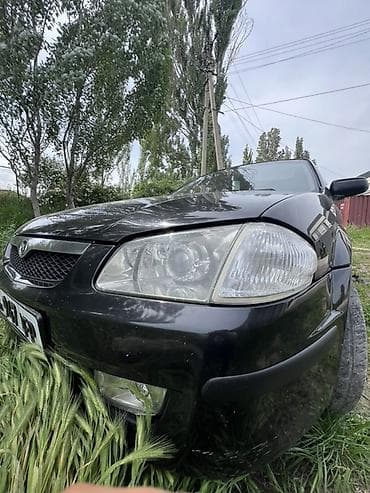 Унаа сатуу: Mazda 323: 1999 г., 1.5 л, Кол менен иштөөчү, Бензин, Хетчбек — 5