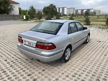 down pipe: Mazda 626: 1998 г., 2 л, Механика, Бензин, Седан — 5
