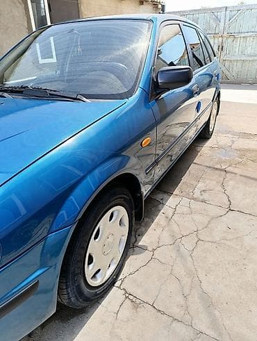 каропка на мазда: Mazda 323: 1999 г., 1.5 л, Автомат, Бензин, Универсал — 5