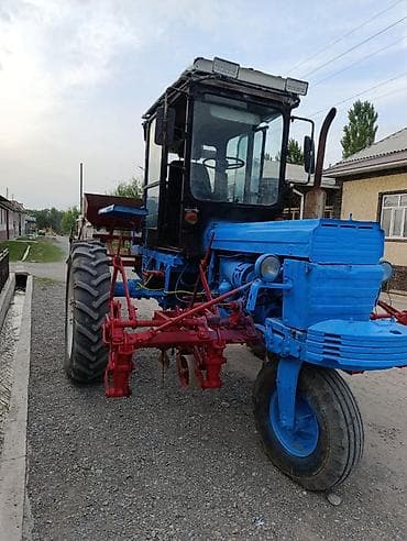 монипулятор кант: Колёсный трактор с навесным культиватором/сеялкой (междурядная — 5