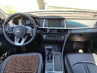 Kia К5 - Просторный салон с кожаной отделкой, задний диван на 3 места