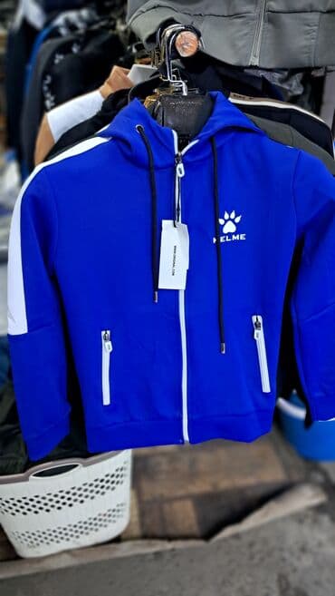 продаю в связи с переездом: Синее двойка на молнии KELME с капюшоном, белыми вставками на рукавах — 1