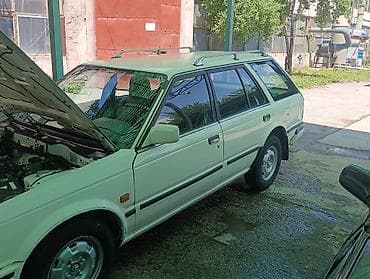 машина byd e2: Nissan Sunny: 1990 г., Бензин, Универсал — 1