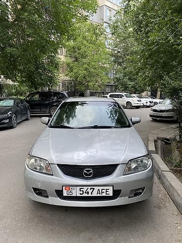 биайди авто цена: Mazda 323: 2002 г. — 3