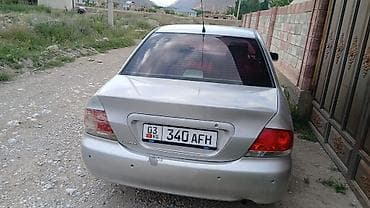 электромобиль лабо: Mitsubishi Lancer: 2002 г., Механика, Бензин, Седан — 2