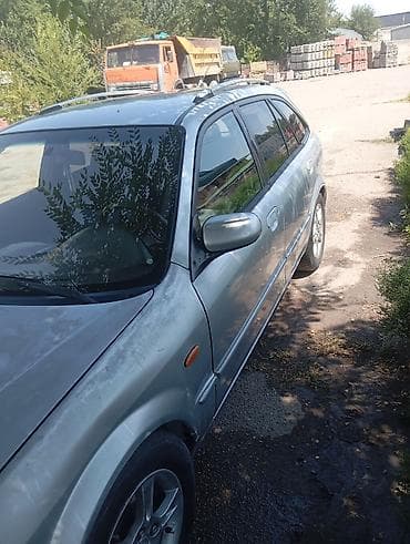 домкрат на фит: Mazda Familia: 2002 г., 1.6 л, Механика, Бензин, Универсал — 8