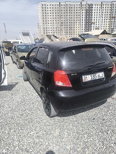 шевралет трак: Черный шевролет Авео Компактный черный хэтчбек класса B/C. - Кузов — 2