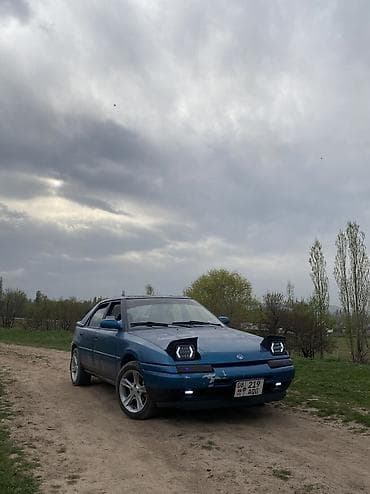 2107 газ: Mazda 323: 1992 г., 1.6 л, Механика, Бензин, Хетчбек — 5