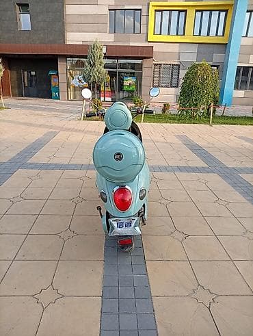 wuling mini ev: Электроскутер в ретро-стиле, мятного цвета Основные особенности: - — 5