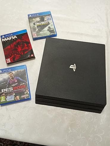 игры на плейстейшн 3: Игровая консоль Sony PlayStation 4 про (черная) + комплект аксессуаров — 1