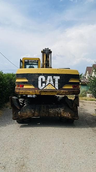 ef m: Экскаватор, Caterpillar, Колесный — 4