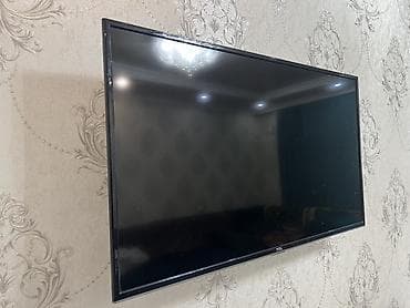 tcl c755 купить: Телевизор TCL, диагональ приблизительно 40–43". Тонкие рамки, корпус — 2