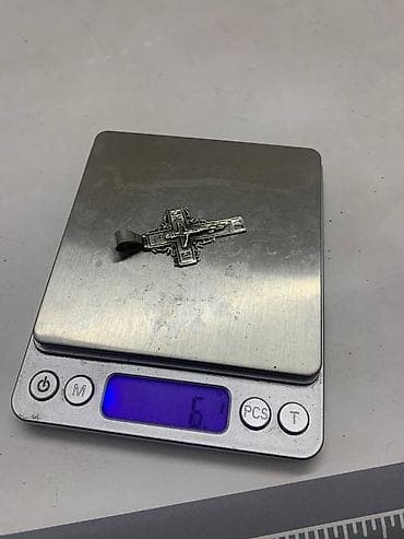 серебряный крестик: Серебряная цепочка Якорь. Вес цепочки составляет 35,2 грамма. Замок — 3