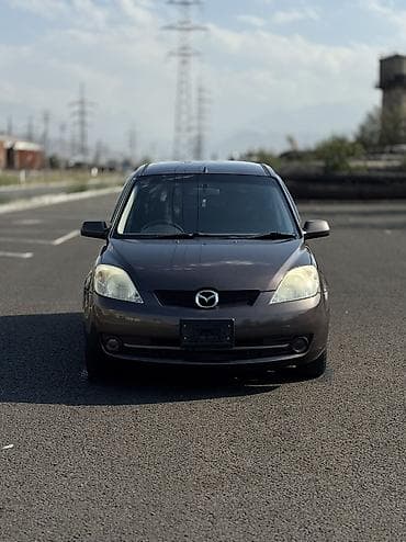 bcd com: Mazda Demio: 2006 г., 1.3 л, Автомат, Бензин, Хэтчбэк — 1