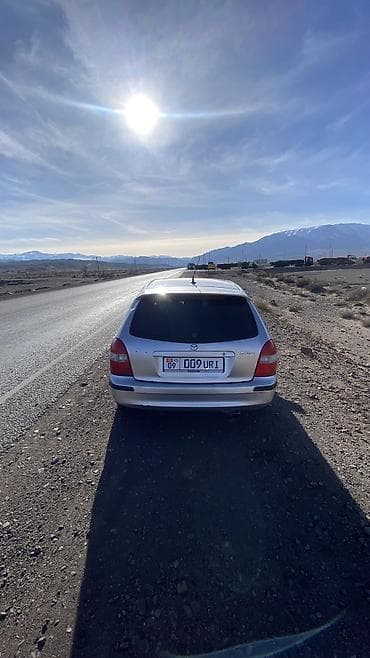 bnw x5: Mazda 323: 1998 г., 1.6 л, Механика, Бензин, Универсал — 7