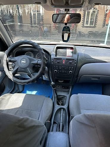 беларус трактор 82 1: Nissan Almera: 2003 г., 1.5 л, Механика, Бензин, Хэтчбэк — 5