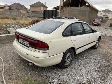 бу машина: Mazda 626: 1994 г., 2 л, Механика, Бензин, Хэтчбэк — 5