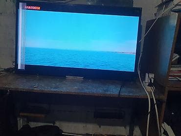 tab s: Телевизор VISION (диагональ примерно 32–40") с LED‑подсветкой. - — 4