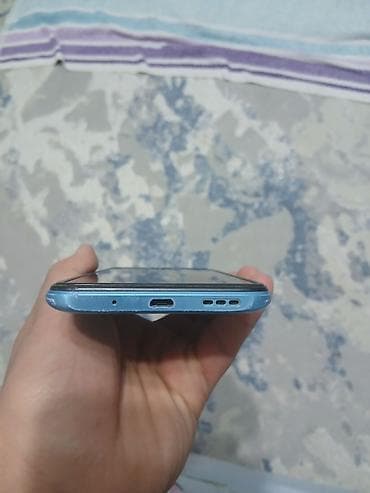 ayfon se: Смартфон с каплевидным вырезом экрана, синий корпус. Характеристики и — 3