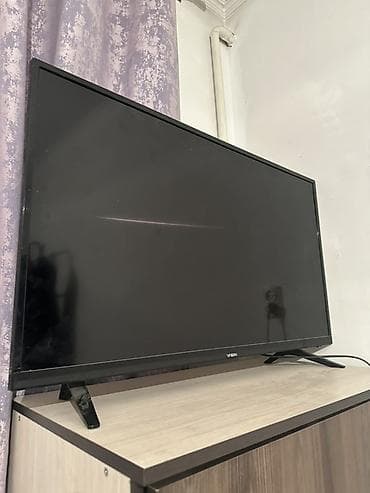 tv zona: Телевизор VISN, диагональ примерно 32–40". Тонкие рамки, устойчивые — 3