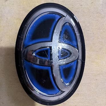 Эмблема (логотип) Toyota Hybrid синяя, Rav 4 1
Имеется трещины !!!