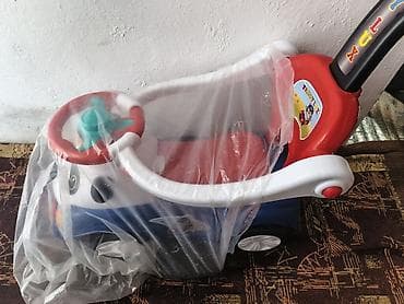 Детская каталка‑толокар с ручкой для родителей.Новая подарили но у нас