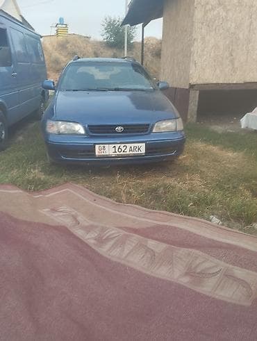 каракол авто: Toyota Carina E: 1997 г., 1.8 л, Кол менен иштөөчү, Газ, Универсал — 1
