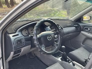 кузов мазда: Mazda 323: 2003 г., 1.6 л, Ручные, Бензин, Седан — 9
