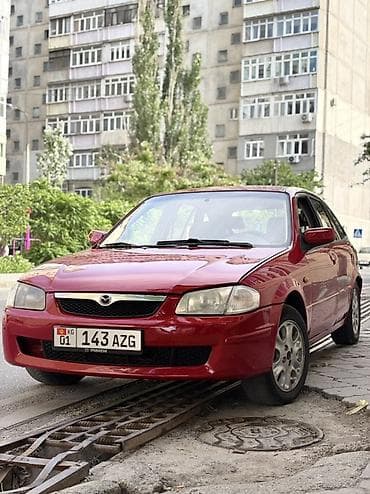x 5: Mazda 323: 1998 г., 1.5 л, Механика, Бензин, Универсал — 5