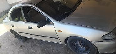 genesis 80: Mazda 323: 1996 г., 1.3 л, Механика, Бензин, Седан — 4