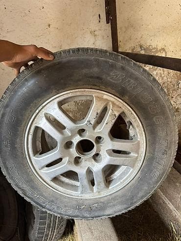 и 16: Литой автомобильный диск с шиной Bridgestone Dueler H/T — 1