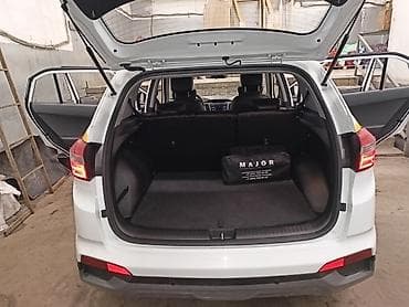 тарпеда тико: Hyundai Creta (белый кузов, черная крыша) с фирменной оклейкой Яндекс — 6