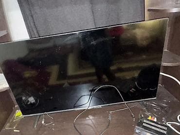 мастер по тв антеннам: Телевизор с плоской панелью (примерно 40–50"), черная рамка, на — 2