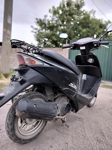 Мототехника: Honda Dio — городской скутер в чёрном цвете. Основные характеристики — 4
