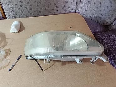 очки зрение: Передняя правая фара Nissan Б/у — 2