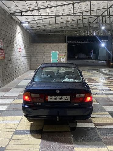 люки крыши: Mazda 323: 1997 г., 1.5 л, Автомат, Бензин, Седан — 4