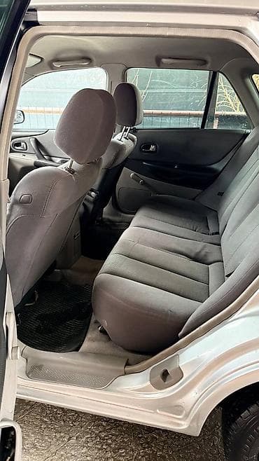 kia clarus: Mazda 323: 2001 г., 1.6 л, Ручные, Бензин, Универсал — 7