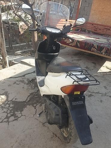 скутера: Скутер Honda (серия Dio) с ветровым стеклом. Характеристики и — 4