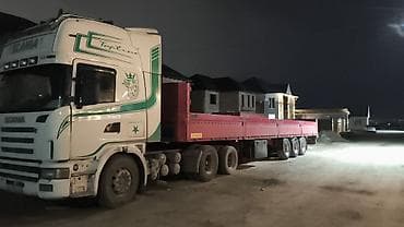 Услуги грузоперевозок бортовым полуприцепом - Тягач Scania с