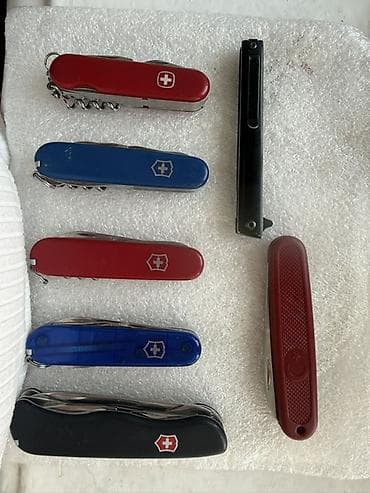 бутылок: Набор многофункциональных складных ножей, включающий модели Victorinox — 1