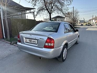 Mazda 323: 2003 г., 1.6 л, Механика, Бензин, Седан