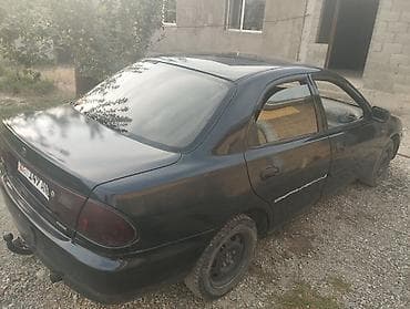 Mazda 323: 1996 г., 1.8 л, Механика, Бензин, Седан — 4